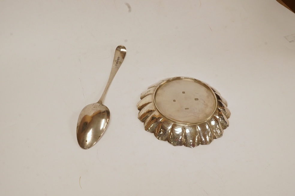 A modern silver dish by D.J. Anderson, London, 1998, diameter 14.4cm, together with a George III silver Old English pattern table spoon, by Peter, Ann & William Bateman, London, 1803, 7.8oz. Condition - fair to good